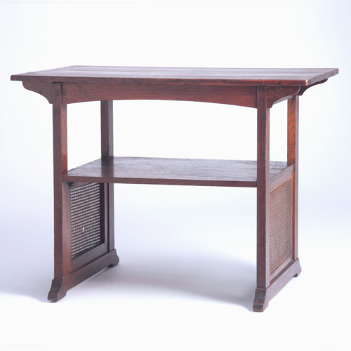 Appraisal: STICKLEY BROTHERS Library table with cane side panels corbeled top