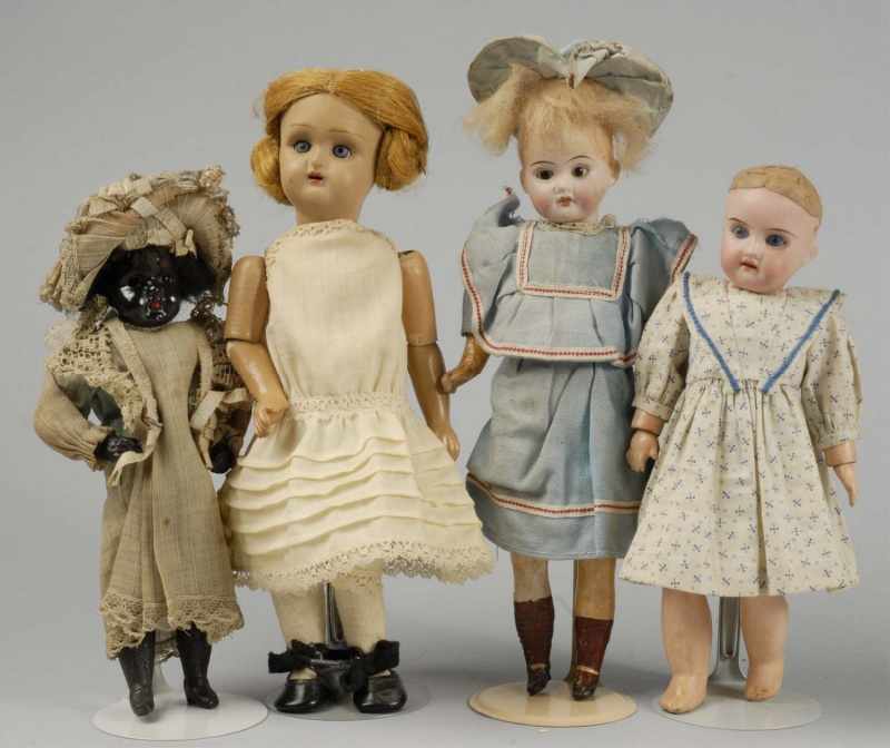 Appraisal: Lot of Bisque Head Dolls Description German black Belton-style Child