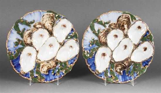 Appraisal: Pair of Limoges painted parcel-gilt porcelain Presidential pattern oyster plates