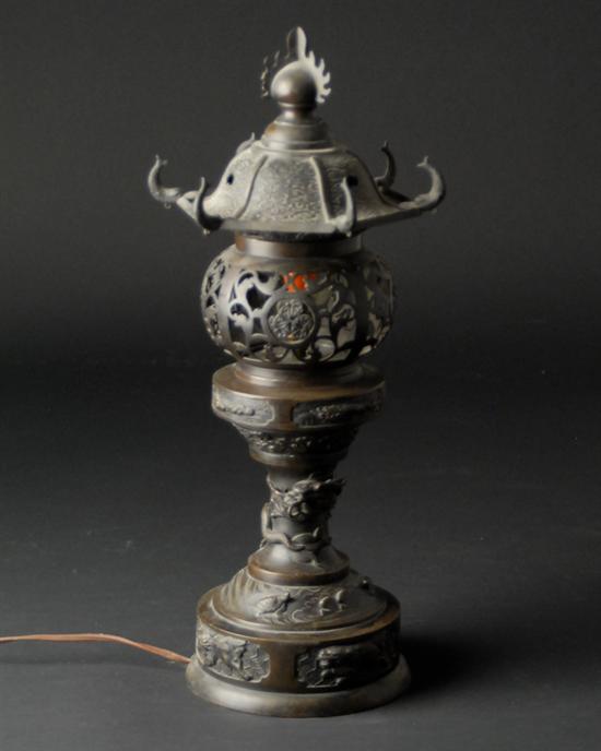 Appraisal: A Japanese Bronze Lantern having a pagoda top with fish