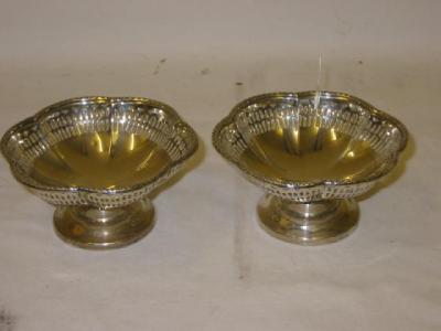 Appraisal: A PAIR OF BONBON DISHES of lobed circular form with