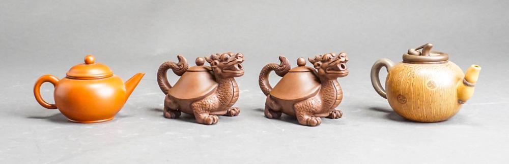 Appraisal: FOUR CHINESE YIXING WARE STYLE TEAPOTSFour Chinese Yixing Ware Style