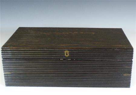 Appraisal: A th century ebonised wood writing slope of reeded design