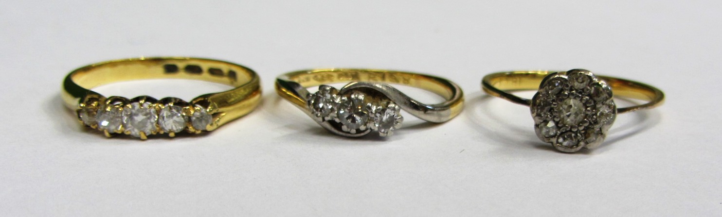 Appraisal: A gold and diamond set five stone ring mounted with