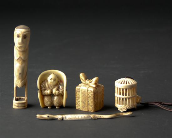 Appraisal: Five Small Carved Ivory or Other Items a gift box