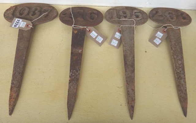 Appraisal: Four cast iron grave markers th century each with different