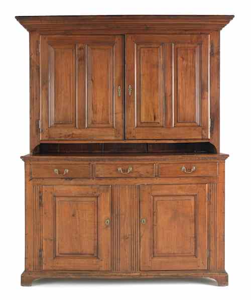 Appraisal: Pennsylvania walnut two-part wall cupboard ca the upper section with