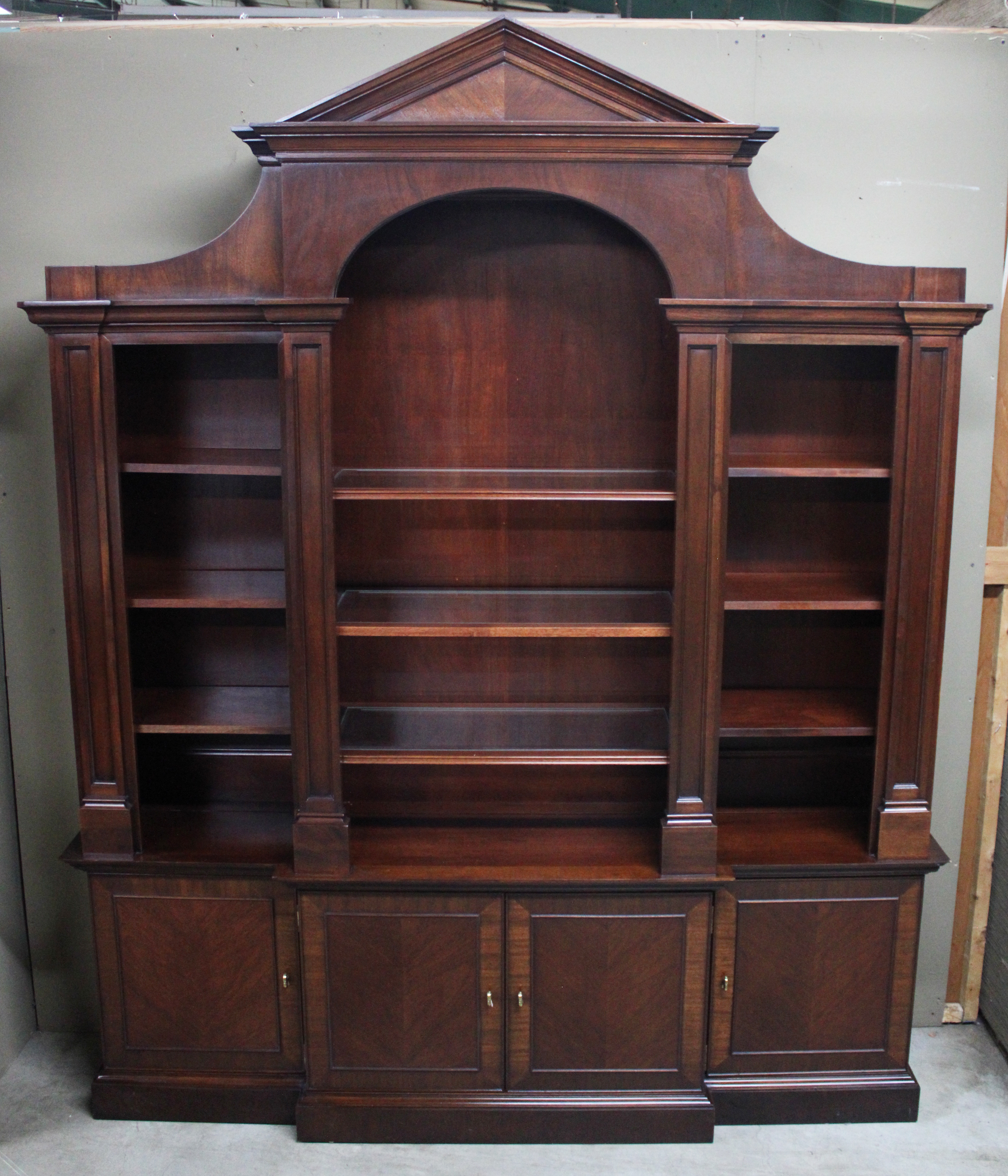 Appraisal: ENGLISH STYLE MAHOGANY BREAKFRONT BOOKCASE English style mahogany breakfront bookcase