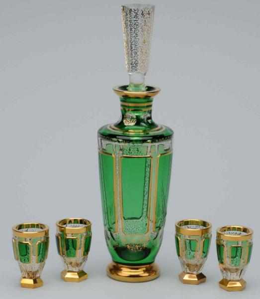 Appraisal: Moser Decanter Cordials Set Description Emerald green with gold trim