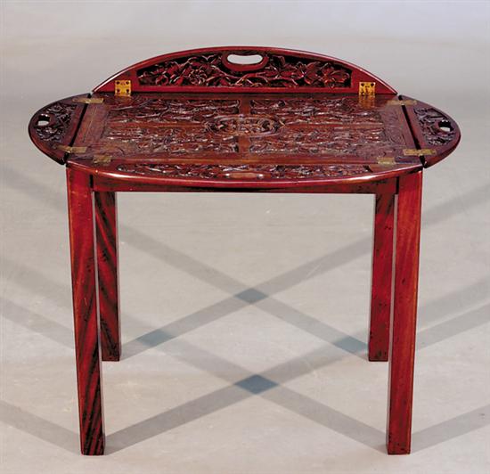 Appraisal: Anglo-Indian carved mahogany butler's tray on stand oval-form tray with