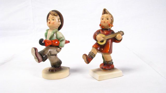 Appraisal: MI Hummel Full Bee Mark Figurines including Happy Traveler and