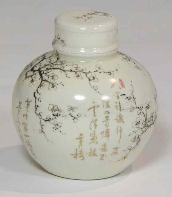 Appraisal: A Japanese earthenware globular jar and cover painted with prunus