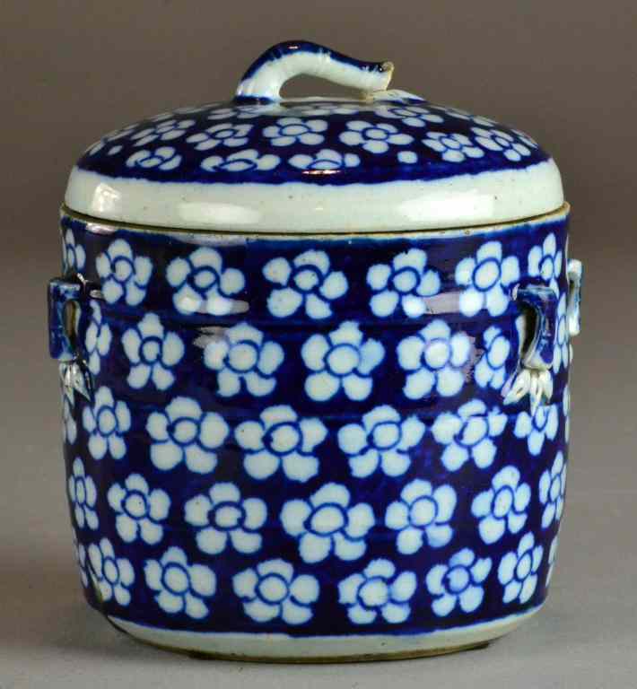 Appraisal: Chinese Qing Blue White Porcelain Covered JarsDepicting lotus with fruit