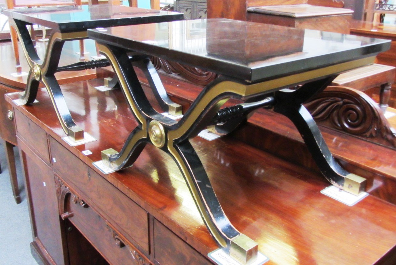 Appraisal: A pair of th century ebonised parcel gilt occasional tables