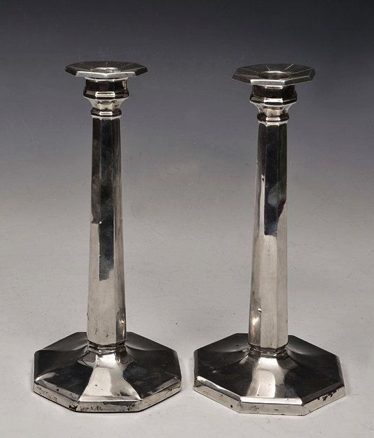 Appraisal: A PAIR OF OCTAGONAL SHAPED SILVER CANDLESTICKS of tapering form