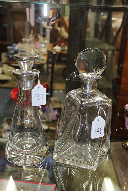 Appraisal: A SILVER MOUNTED CUT GLASS DECANTER with shell shaped stopper