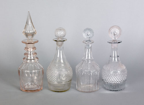 Appraisal: Four colorless blown glass decanters th c two - h