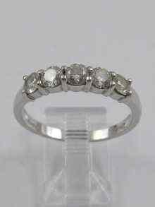 Appraisal: A hallamrked ct white gold ring set with five diamonds