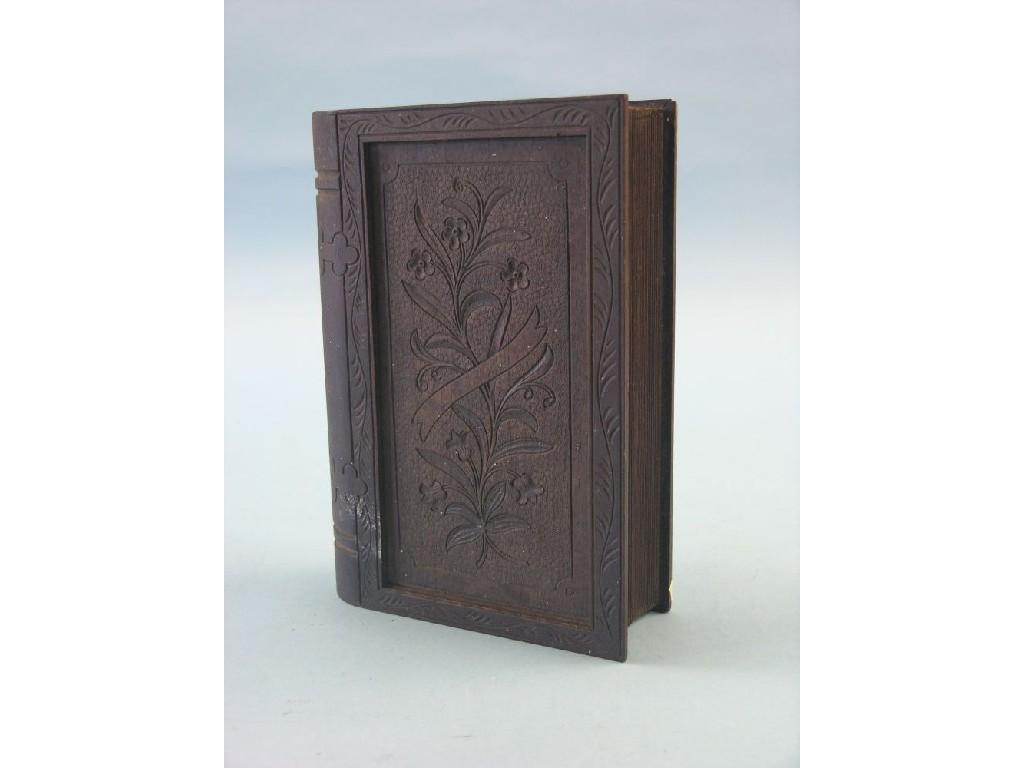 Appraisal: An Edwardian carved walnut cigar box in the form of