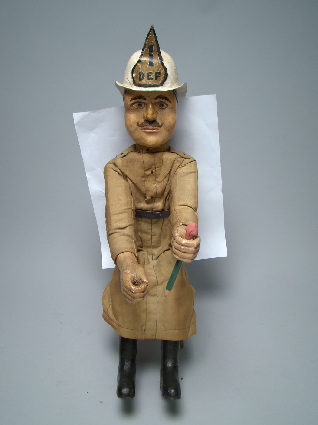 Appraisal: CARVED AND PAINTED WOODEN MODEL OF A FIREMAN Early th