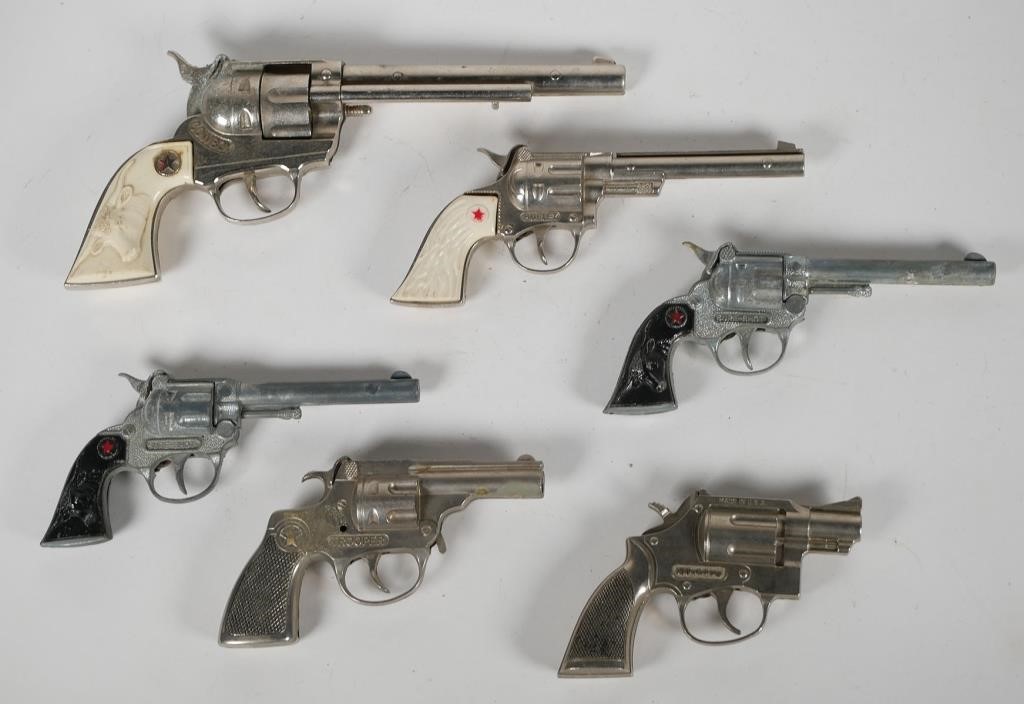 Appraisal: VINTAGE TOY REVOLVERSGroup of six cap gun revolvers Pair Hubley