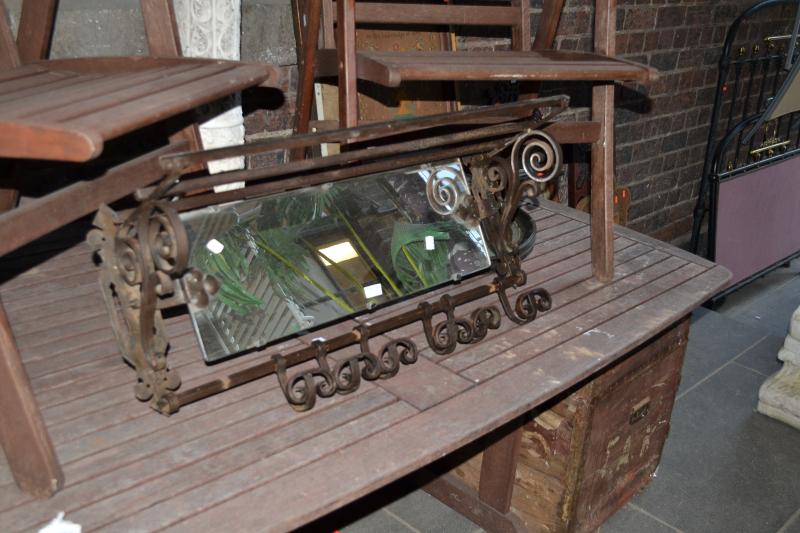 Appraisal: AN ORNATE WROUGHT IRON WALL MOUNTED RACK WITH MIRROR AN