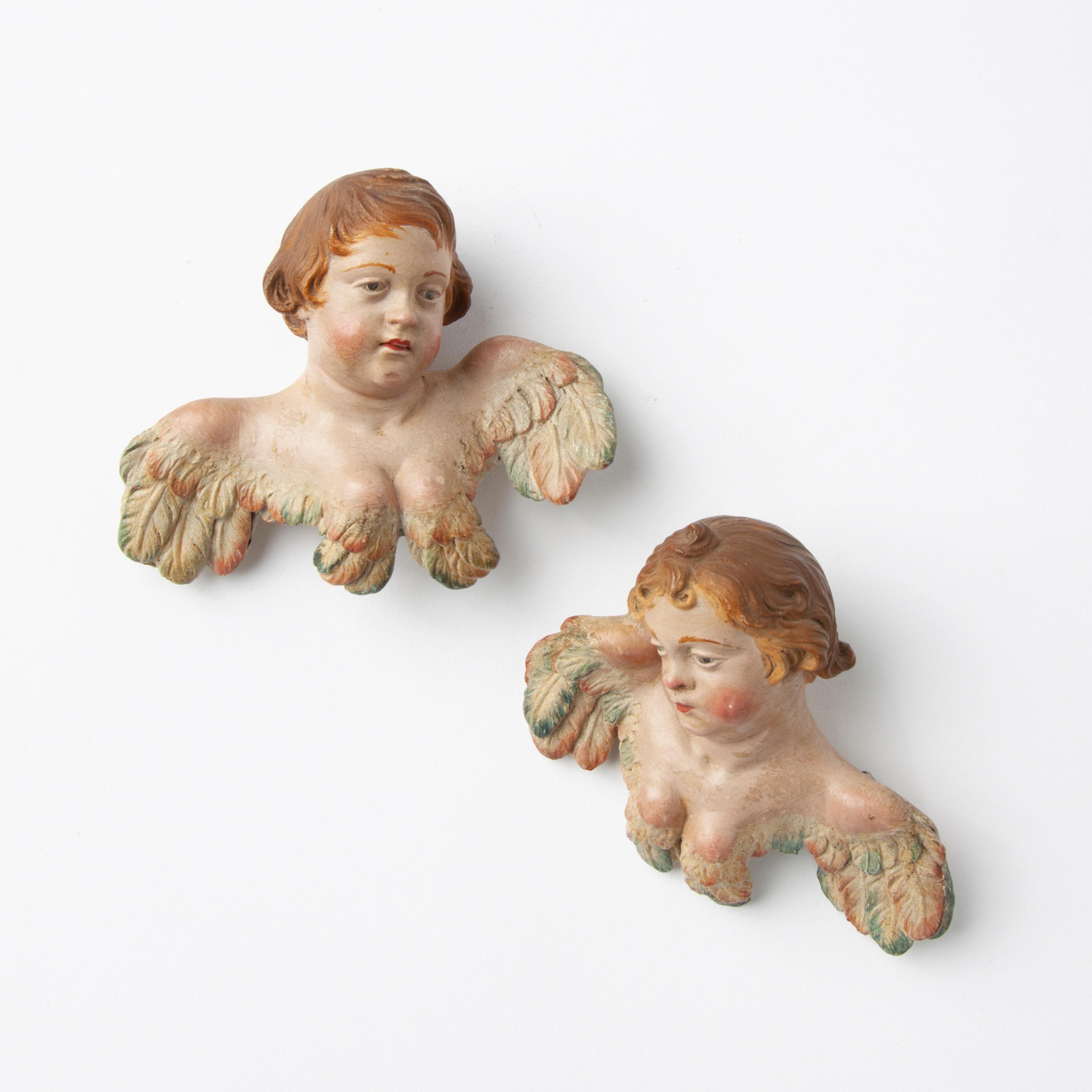 Appraisal: PAIR OF TH C POLYCHROME TERRA COTTA CHERUBIM A very