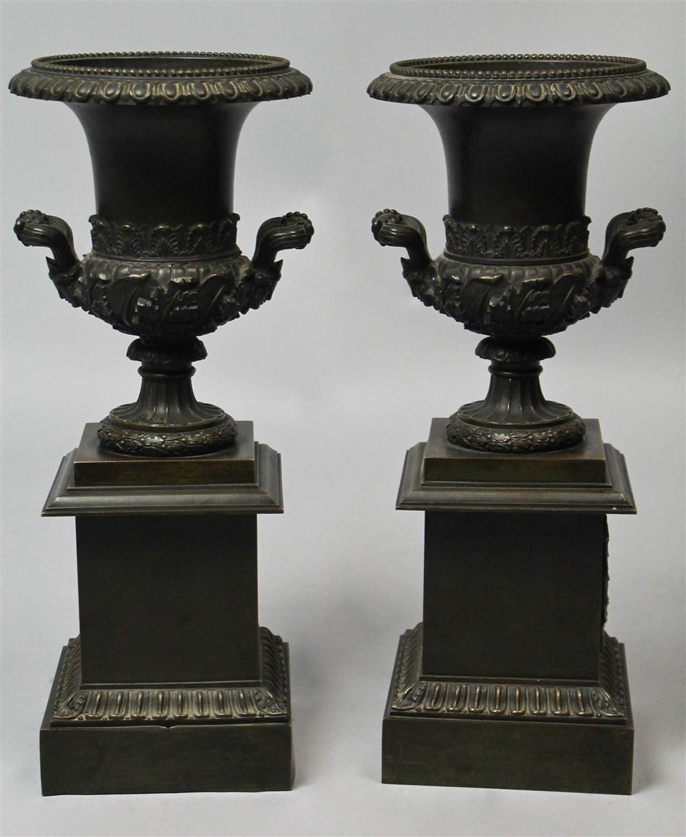 Appraisal: PAIR OF PATINATED METAL CAMPAGNA URNS of typical shape the