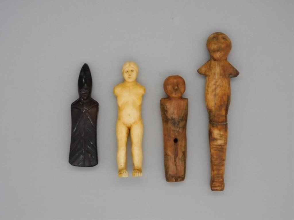 Appraisal: INUIT CARVED FIGURES PREHISTORIC- THcentury Male and female figures done