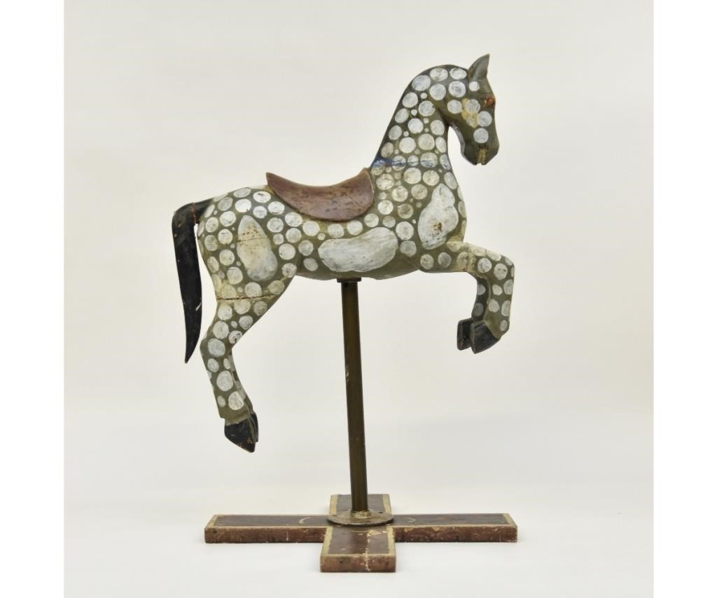 Appraisal: Carved jumping dappled painted wooden horse metal pole and wood