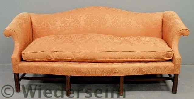 Appraisal: Chippendale style mahogany camelback sofa with orange Scalamandre upholstery h