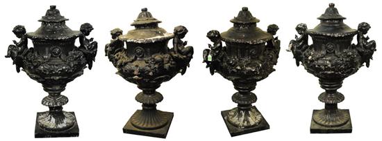 Appraisal: SET OF FOUR LEAD URNS th century each adorned with