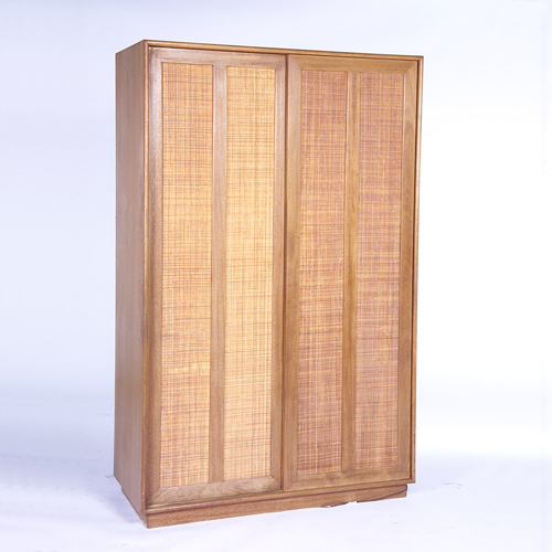 Appraisal: HARVEY PROBBER Wardrobe with two caned sliding doors concealing a