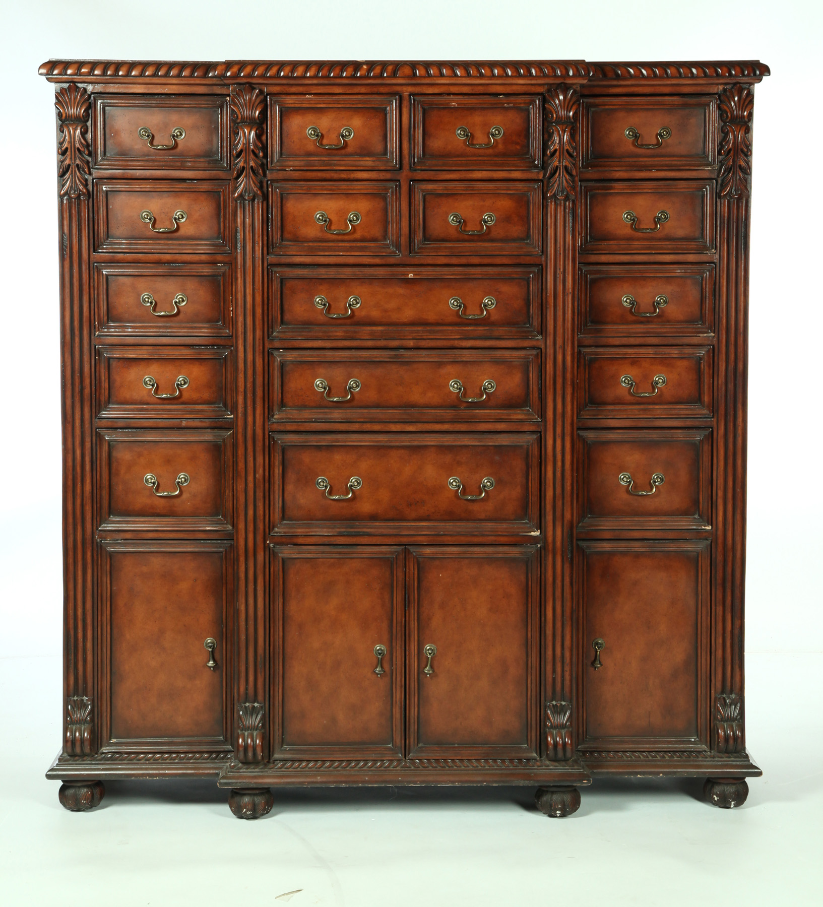 Appraisal: UNUSUAL CHIPPENDALE-STYLE BREAKFRONT CHEST OF DRAWERS Twentieth century hardwood with