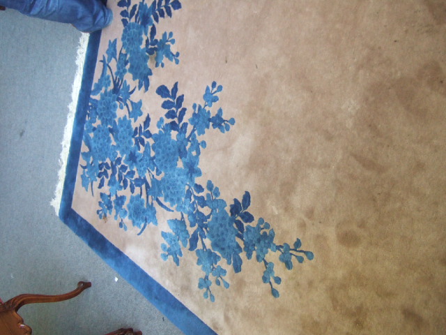 Appraisal: A Chinese large carpet the tan field with blue flower