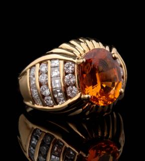 Appraisal: AN K FASHION RING WITH CARAT ORANGE SAPPHIRE An elegant