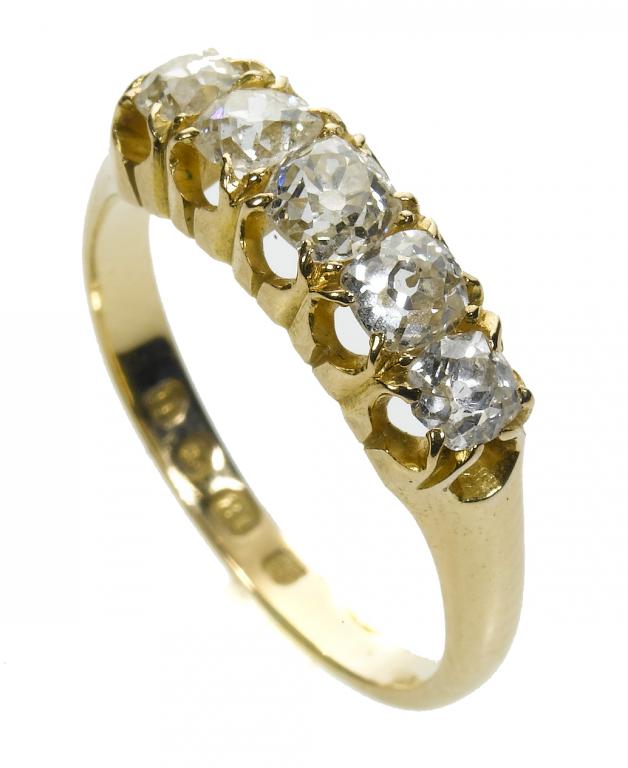 Appraisal: A DIAMOND FIVE-STONE RING with a line of old cut