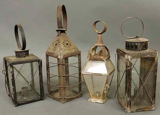 Appraisal: Group of three tin lanterns with glass sides th c