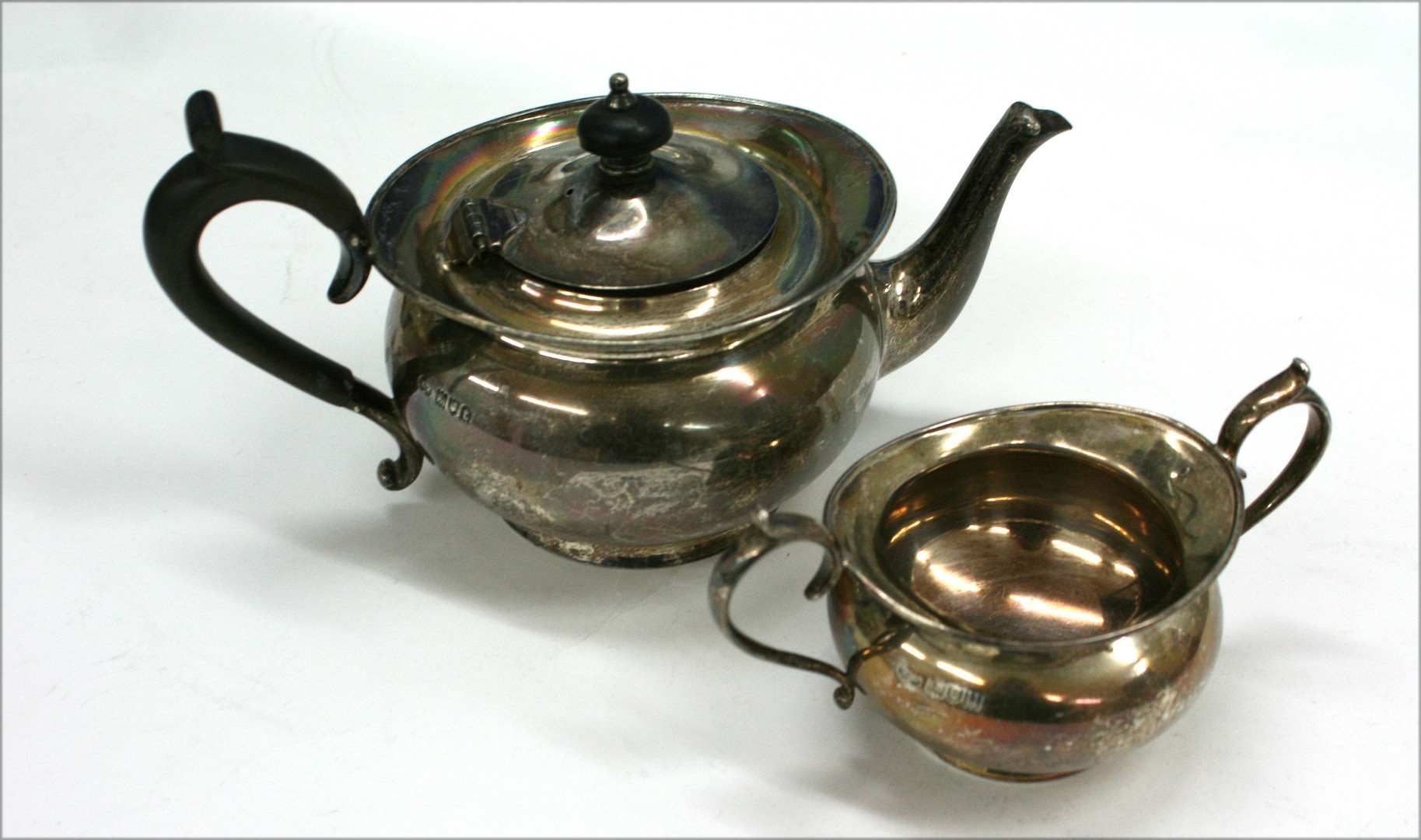 Appraisal: A bachelor George III style compressed circular silver teapot and