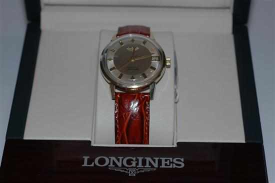 Appraisal: A LONGINES AUTOMATIC WRISTWATCH WITH BATON NUMERALS AND DATE APERTURE