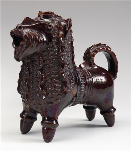 Appraisal: Figural redware lion jug circa Glazed all over in a