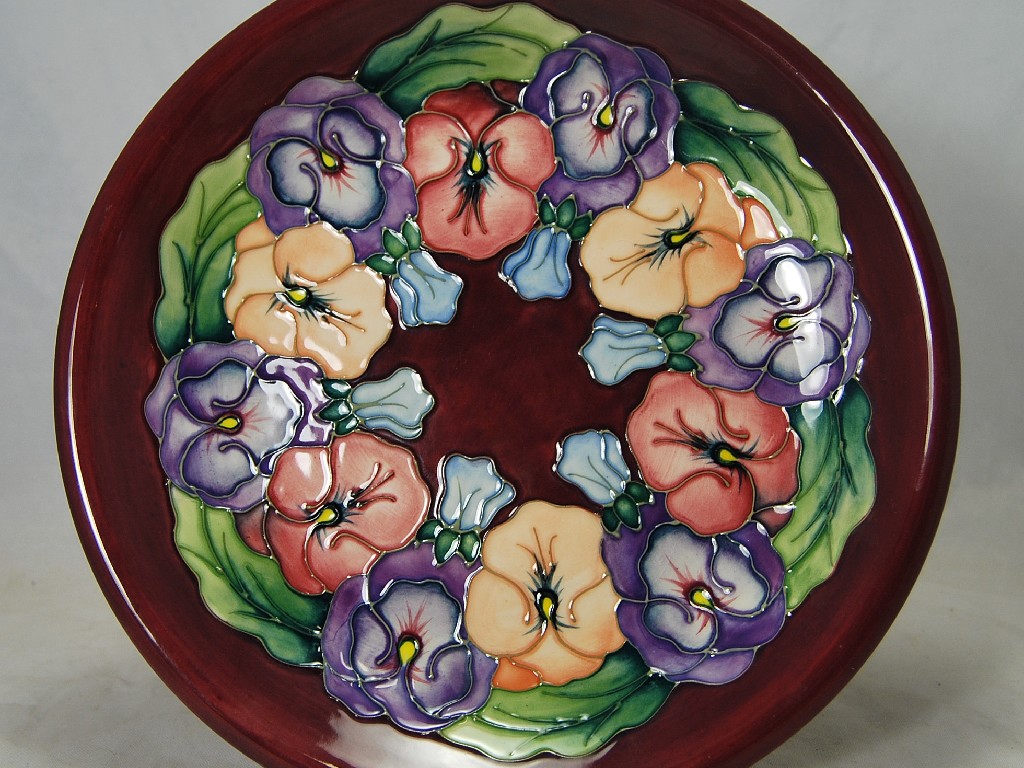 Appraisal: Contemporary Moorcroft plate pansy pattern on a purple ground cm