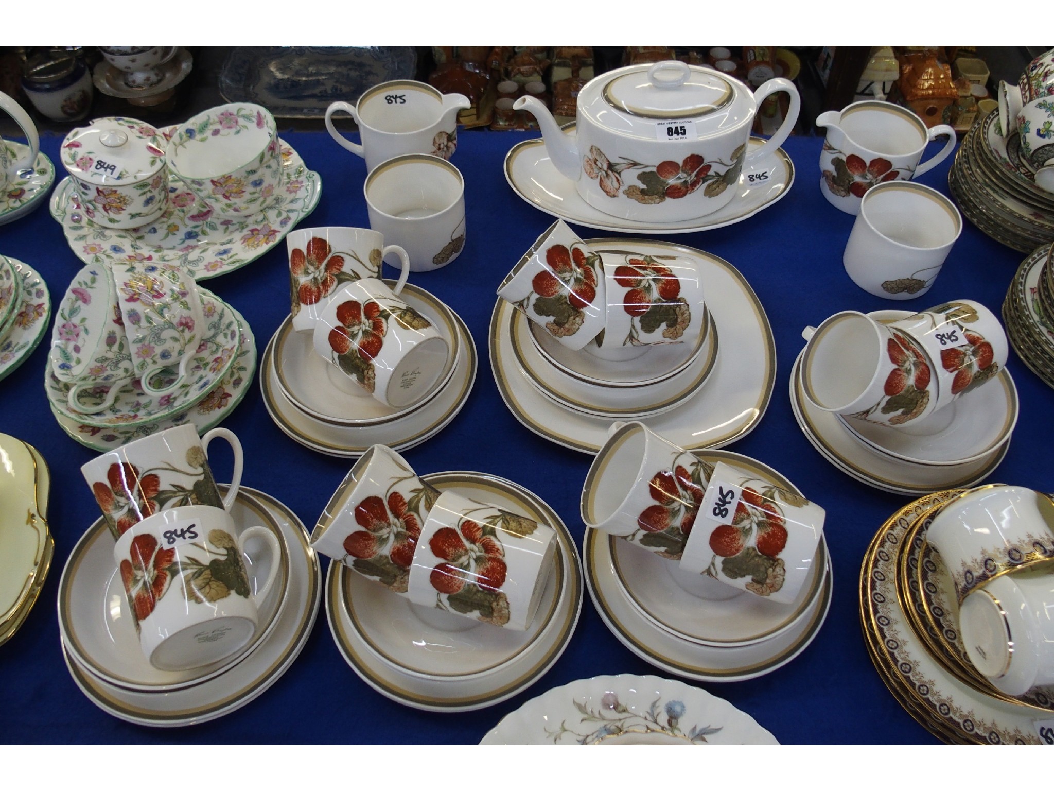 Appraisal: A Wedgwood Susie Cooper 'Nasturtium' pattern teaset comprising teapot cake