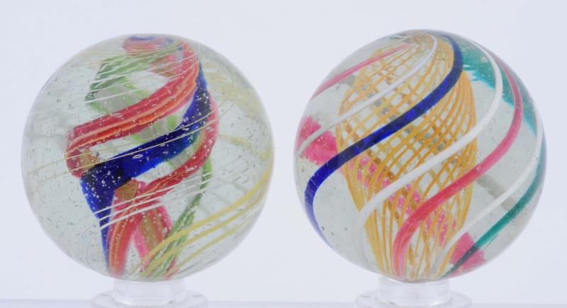 Appraisal: Lot Of Swirl Marbles Lot includes one yellow latticino swirl