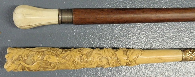 Appraisal: Ebony walking stick the ivory handle carved with boar s