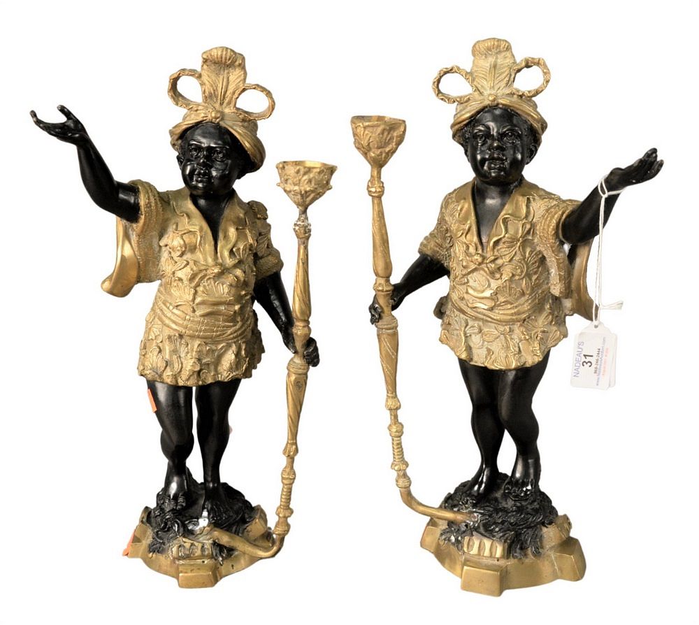 Appraisal: Pair of Bronze Blackamoor Figures each holding a staff height