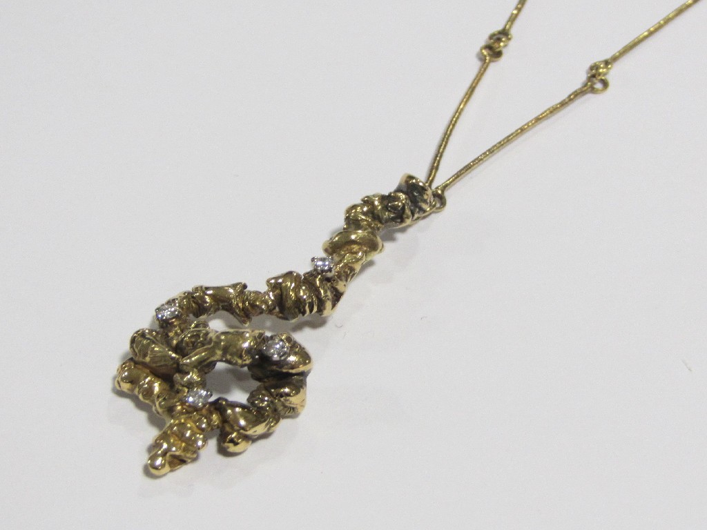 Appraisal: A contemporary ct gold diamond set nougat style pendant with