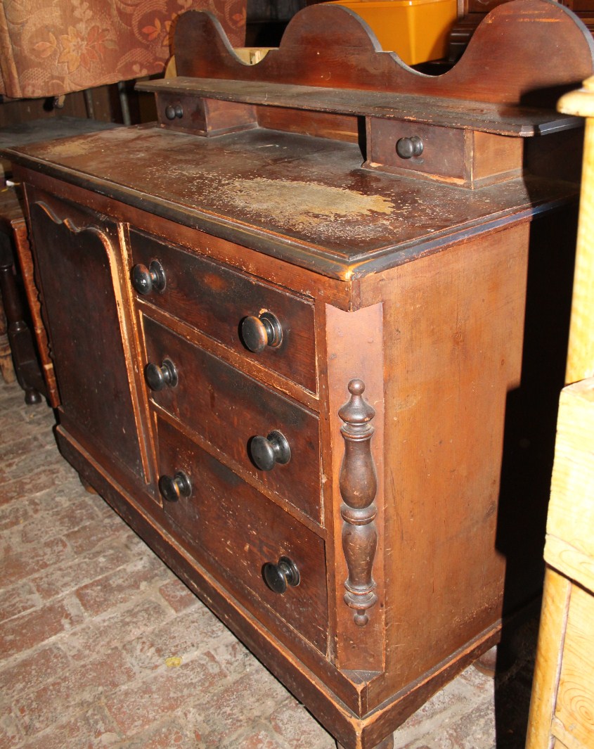 Appraisal: A thC stained pine Lincolnshire dresser with a shaped top