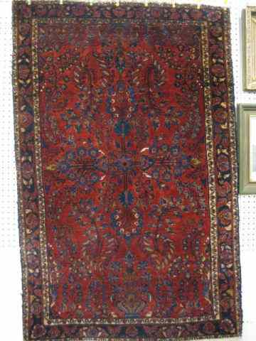 Appraisal: Sarouk Persian Handmade Rug semi-antique elaborate floral on burgundy field