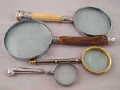 Appraisal: Three magnifying glasses one horn one ivory handled with Victorian